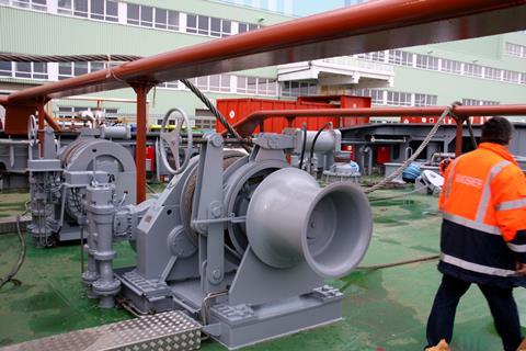 The tow-beams and tugger winches illustrate the size of the deck machinery.